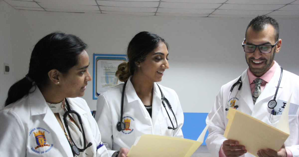 Xavier students discussing a patient