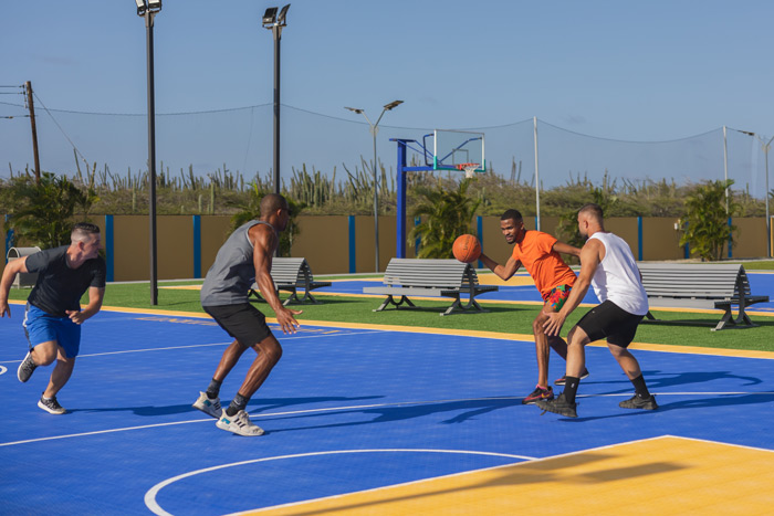 Students playing basketball outdoors
